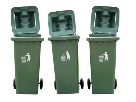 Workers wearing PPE handling commercial waste bins